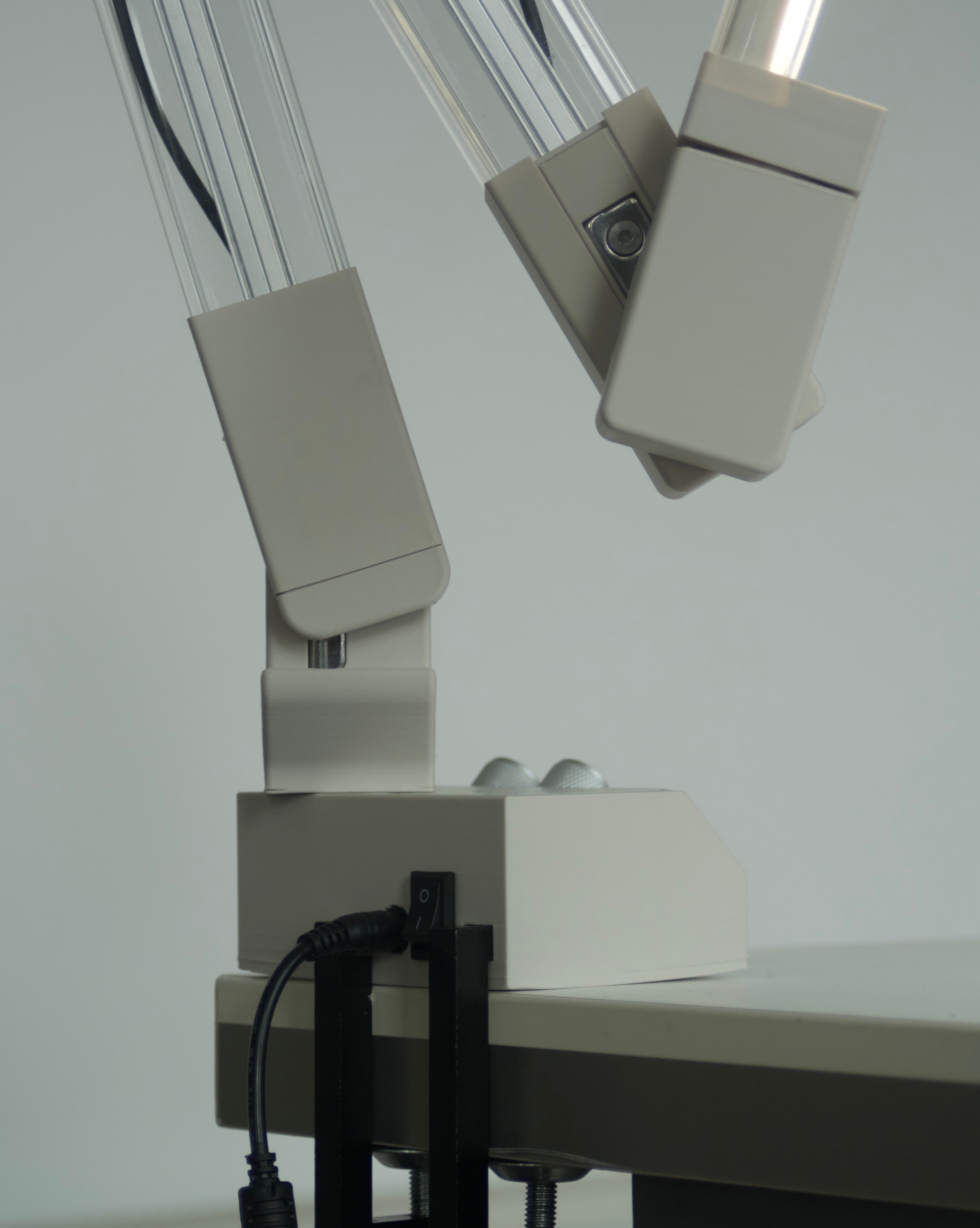 Close-up of SOL-ONE's arm joints and desk clamp